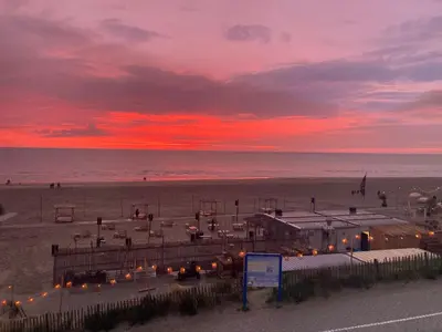 a view of a beach with a sunset at Villa Zandvoort in Zandvoort