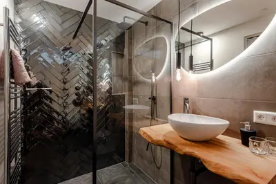 a bathroom with a sink and a shower at Bed and Beach Zandvoort in Zandvoort