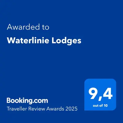 a blue sign with the text awarded to waterolithic lodges at Waterlinie Lodges in Utrecht
