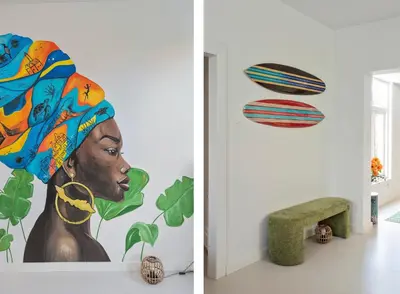 a room with a painting of a woman and planets at Second Paradise for 2 adults and 2 children in Zandvoort