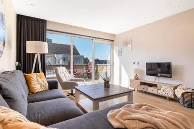 a living room with a couch and a table at Luxury Apartment near Utrecht & Amsterdam in Breukelen