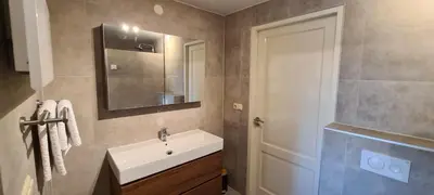 a bathroom with a sink and a mirror at Luxury Apartment near Utrecht & Amsterdam in Breukelen