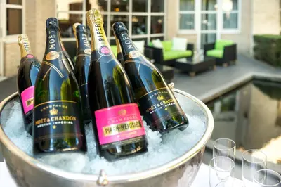 four bottles of wine in a bucket of snow at Golden Tulip Ampt van Nijkerk in Nijkerk