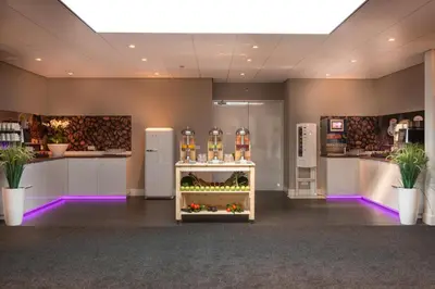 a store with a display of fruits and vegetables at Golden Tulip Ampt van Nijkerk in Nijkerk