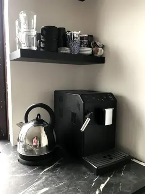a tea kettle sitting on top of a coffee maker at Near Amsterdam and airport, 90m2, privacy! in Hoofddorp