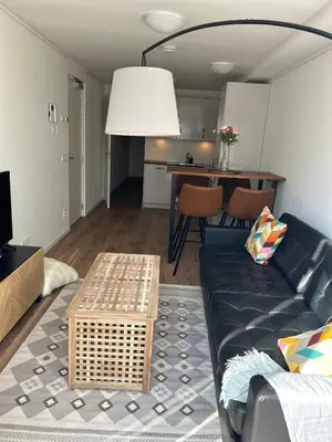 a living room with a couch and a table at Noordwijk BB228 in Noordwijk