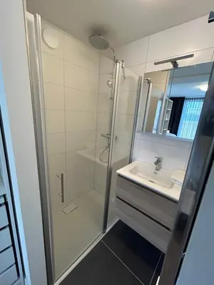 a bathroom with a shower and a sink at Noordwijk BB228 in Noordwijk