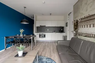 a living room with a couch and a table at YAYS Amsterdam Prince Island by Numa in Amsterdam