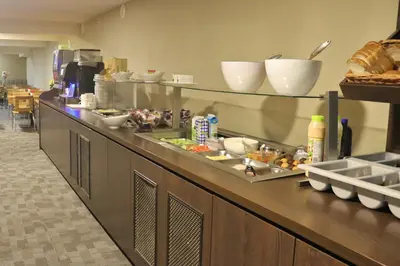 a buffet line in a restaurant with food at XO Hotels Infinity in Amsterdam