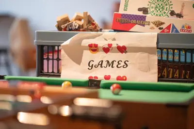 a billiard table with a box of games at City Trip Hostels Amsterdam-Zaandam in Zaandam
