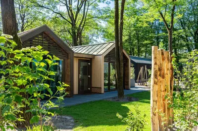 a house in the woods with a garden at Résidence Lage Vuursche in Lage-Vuursche