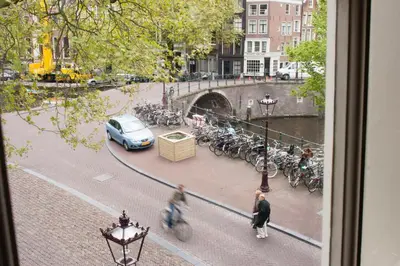 a view from a window of a street with bikes at Hostel The Veteran in Amsterdam