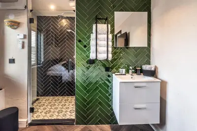 a bathroom with a shower with a sink and a toilet at Beautiful Water Villa, near Schiphol and Amsterdam in Aalsmeer