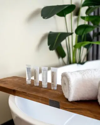 a shelf on top of a toilet in a bathroom at HOTEL ALKMAAR - Bar & Restaurant - Meeting & Events in Alkmaar