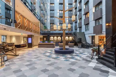 an empty lobby of a building with a staircase at Radisson Blu Hotel, Amsterdam City Center in Amsterdam