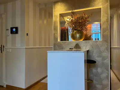 a light in a room with a counter and a mirror at The smallest hotel in Amsterdam in Amsterdam