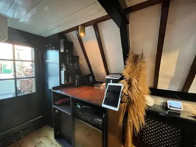 a kitchen with a counter with a stove top oven at The smallest hotel in Amsterdam in Amsterdam
