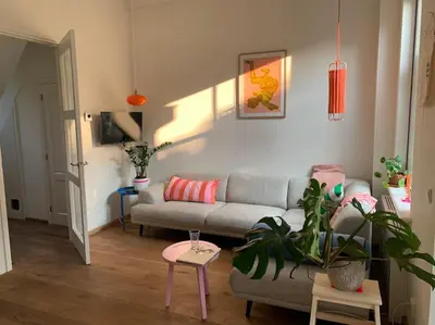 a living room with a couch and a table at The Great Hideaway in Vreeland