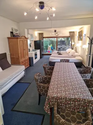 a hotel room with three beds and a kitchen at Duin-Vliet - Free parking in Bentveld
