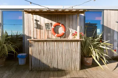 a building with an orange life preserver on a deck at Volkshotel in Amsterdam