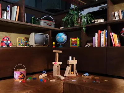 a room with a shelf with books and toys on a table at Volkshotel in Amsterdam