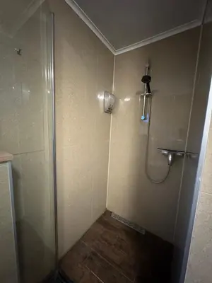 a shower with a glass door in a bathroom at La Luna - Danny in Heerhugowaard
