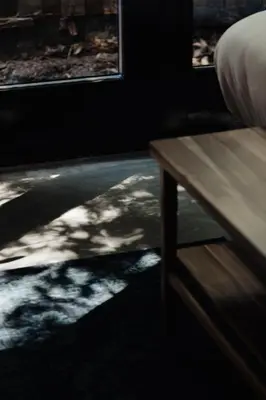 a room with a wooden table and a window at Studio Verver in Bergen