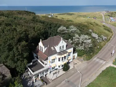 an overhead view of a white house with a brown roof at Mare Sanat in Wijk aan Zee