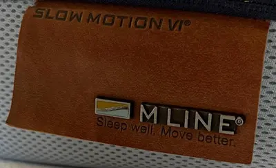 a brown wallet with a sticker on it at Luxe woning ‘BARNS’ Castricum aan Zee + airco + parkeren in Castricum