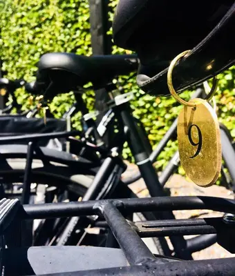 a bicycle with a padlock on the side of it at Boutique hotel Villa Trompenberg in Hilversum