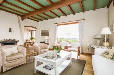 a living room with a couch and a table at Villa de Duintop in Bergen aan Zee
