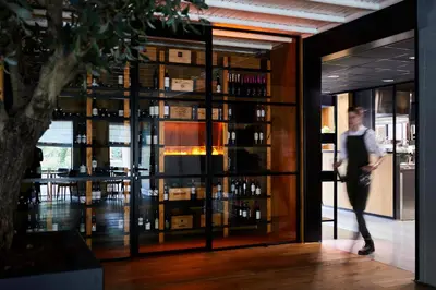 a man is walking into a wine tasting room at Kasteel Kerckebosch in Zeist