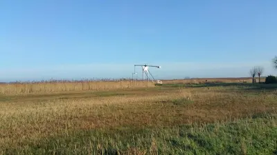 a windmill in the middle of a field at Bed In Waterland in Broek in Waterland