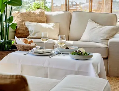a table with two glasses of wine and food on it at Hotel Zonne in Noordwijk aan Zee