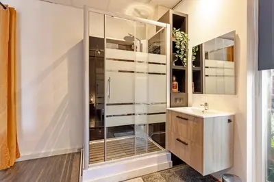a bathroom with a shower and a sink at The marine apartment near Amsterdam by Weltevreden Experience in Kortenhoef