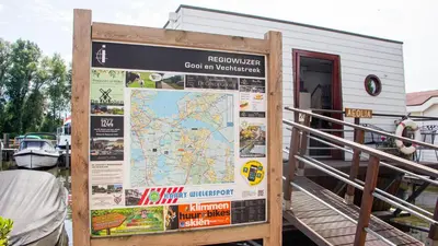 a building with a large map and a sign at The marine apartment near Amsterdam by Weltevreden Experience in Kortenhoef