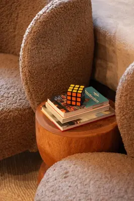 a pile of books sitting on a chair at B&B Midtown Amsterdam suites in Amsterdam