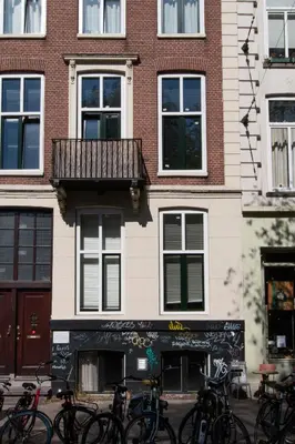 a group of bikes parked in front of a building at B&B Midtown Amsterdam suites in Amsterdam