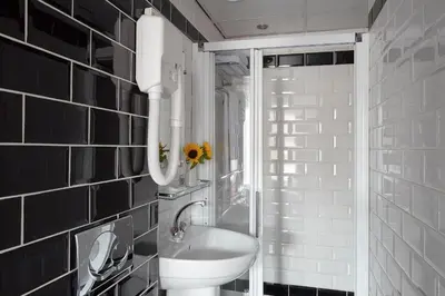 a bathroom with a sink and a toilet in it at Hotel D'Amsterdam Leidsesquare in Amsterdam