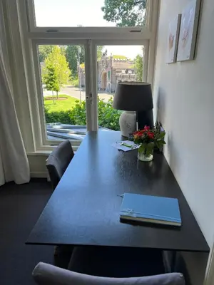 a desk in a room with a window at Room One-Twenty-One in Naarden