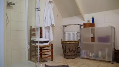 a bathroom with a shower and a towel at Room One-Twenty-One in Naarden
