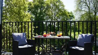 a table with food and drinks on a fence at Room One-Twenty-One in Naarden