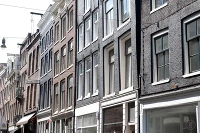 a row of brick buildings on a city street at Hotel IX Nine Streets Amsterdam in Amsterdam