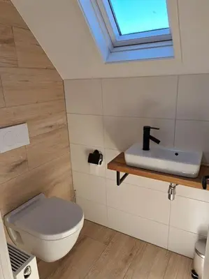 a bathroom with a toilet and a sink at Family House Wakker in Eemnes