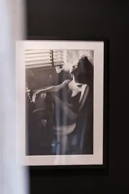 a picture of a woman sitting in a window at Hello Noordwijk - Appartement Duindamseweg 14E in Noordwijk aan Zee
