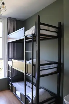 a room with three bunk beds in a room at Amsterdam Hostel Annemarie in Amsterdam