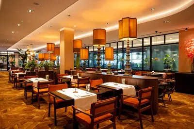a restaurant with tables and chairs and a bar at Van der Valk Hotel Schiphol in Hoofddorp