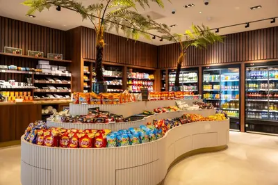 a supermarket with a large display of food and drinks at Van der Valk Hotel Schiphol in Hoofddorp