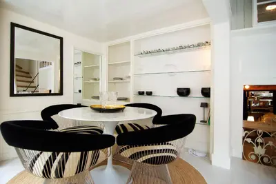 a dining room with a table and chairs at Exceptional Stay in Jordaan Area in Amsterdam