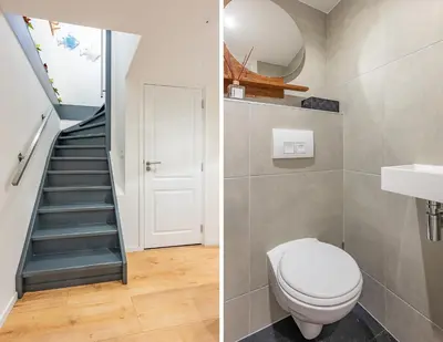 a bathroom with a toilet and a staircase at Watervillashiraz in Aalsmeer